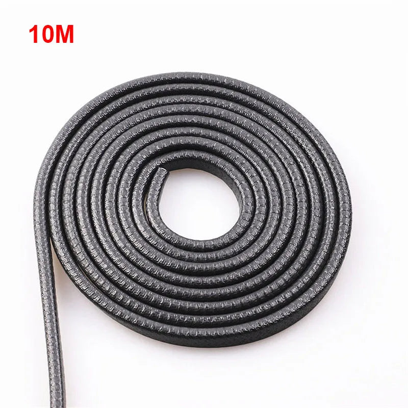 Coiled black elastic band with '10M' label on a white background