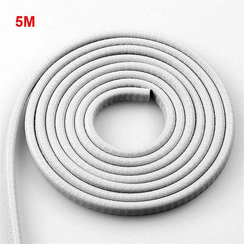 Coiled white cable with a length of 5 meters on a light gray background