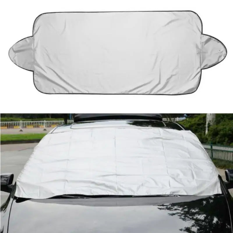 Car sunshade covering a car's windshield with a white background