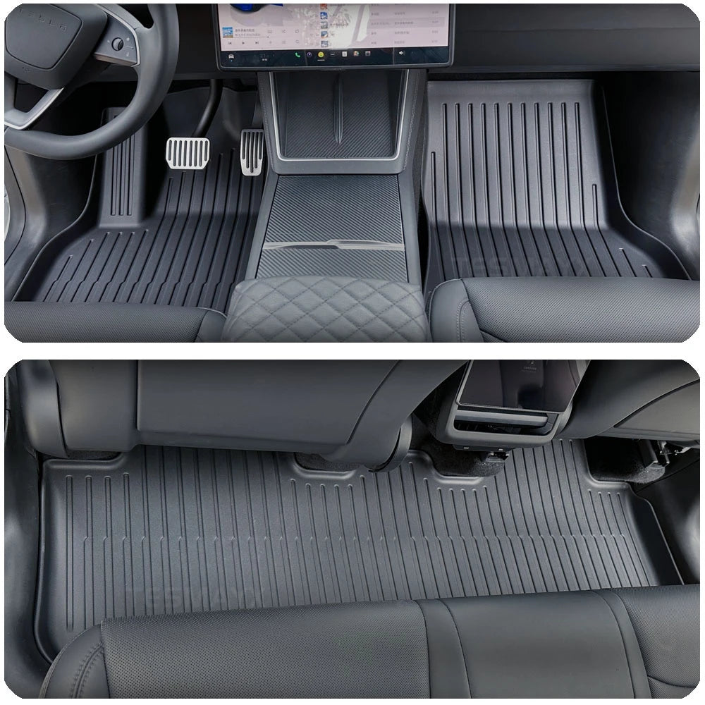 Car interior with black floor mats covering the floor and front seats.