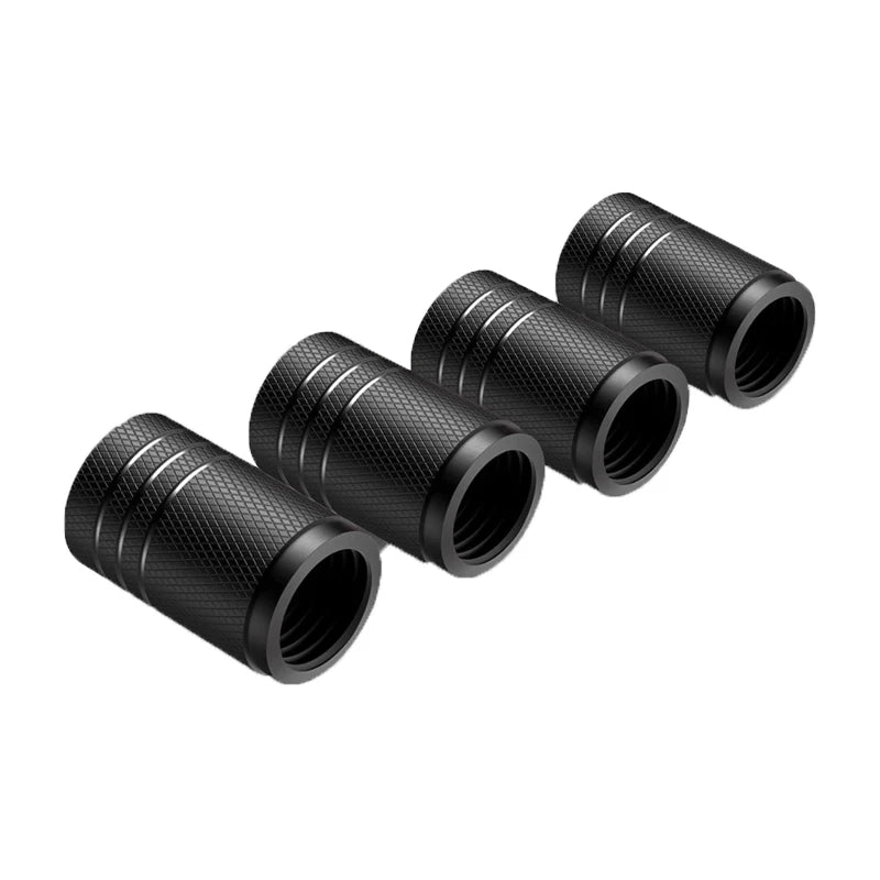 Five black metal cylindrical objects on a white background