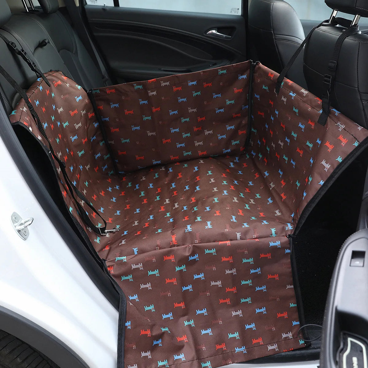 Brown pet car seat cover with dog pattern in a car