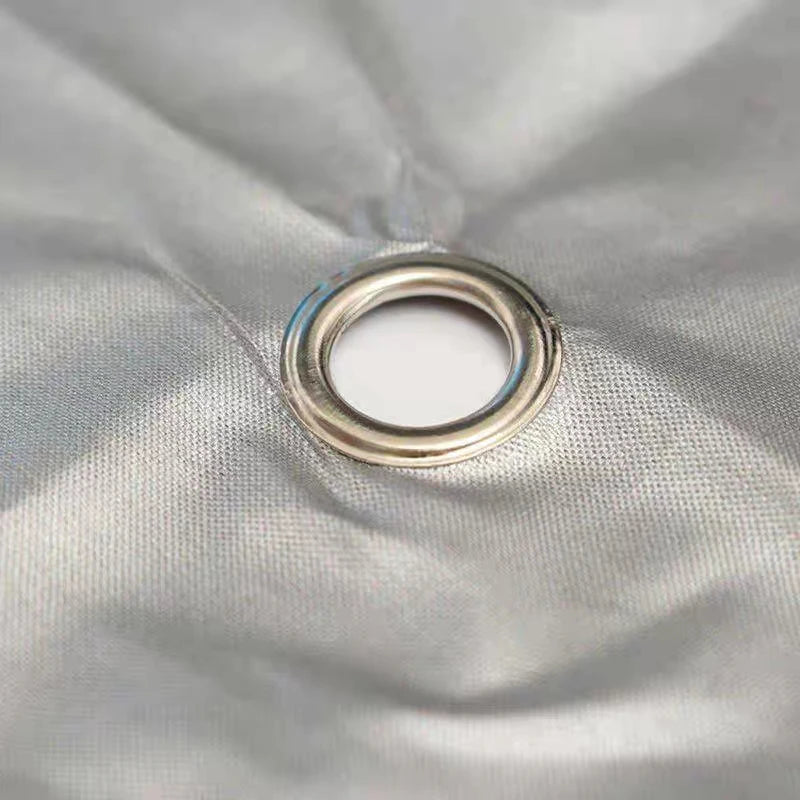 Metal grommet on a piece of fabric