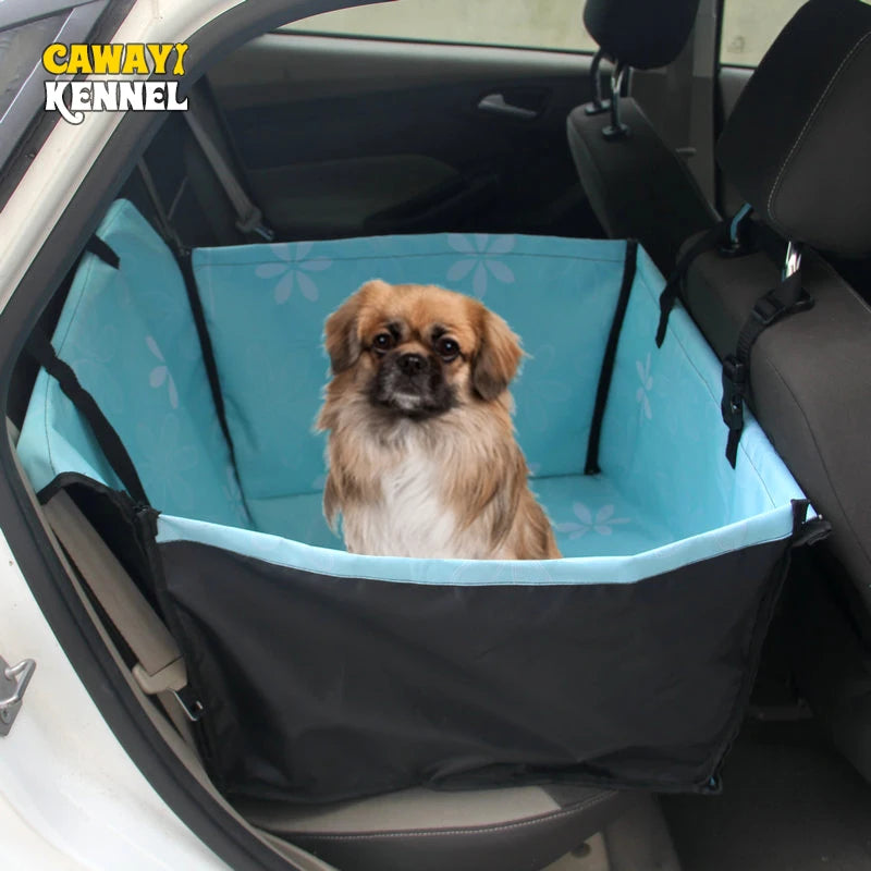Dog sitting in a blue pet seat cover inside a car with 'CAWAYI KENNEL' branding.