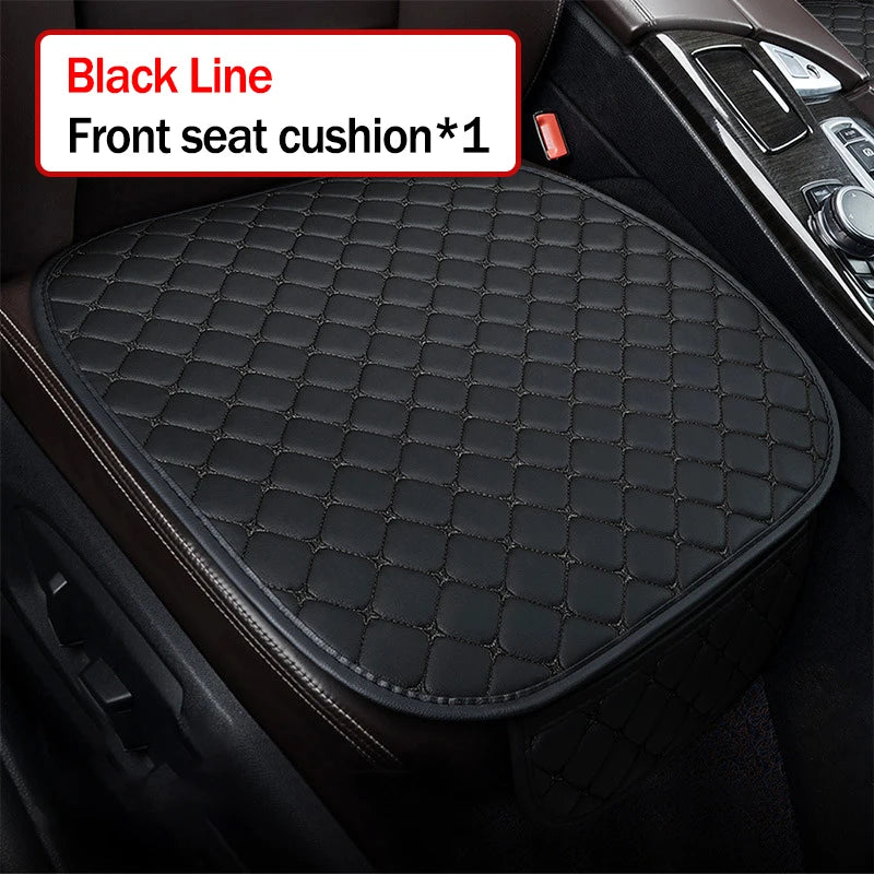 Black quilted car seat cushion on a car seat with text indicating it is a front seat cushion.