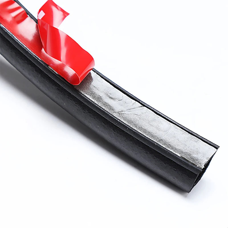 Window cleaning squeegee with red handle on a white background