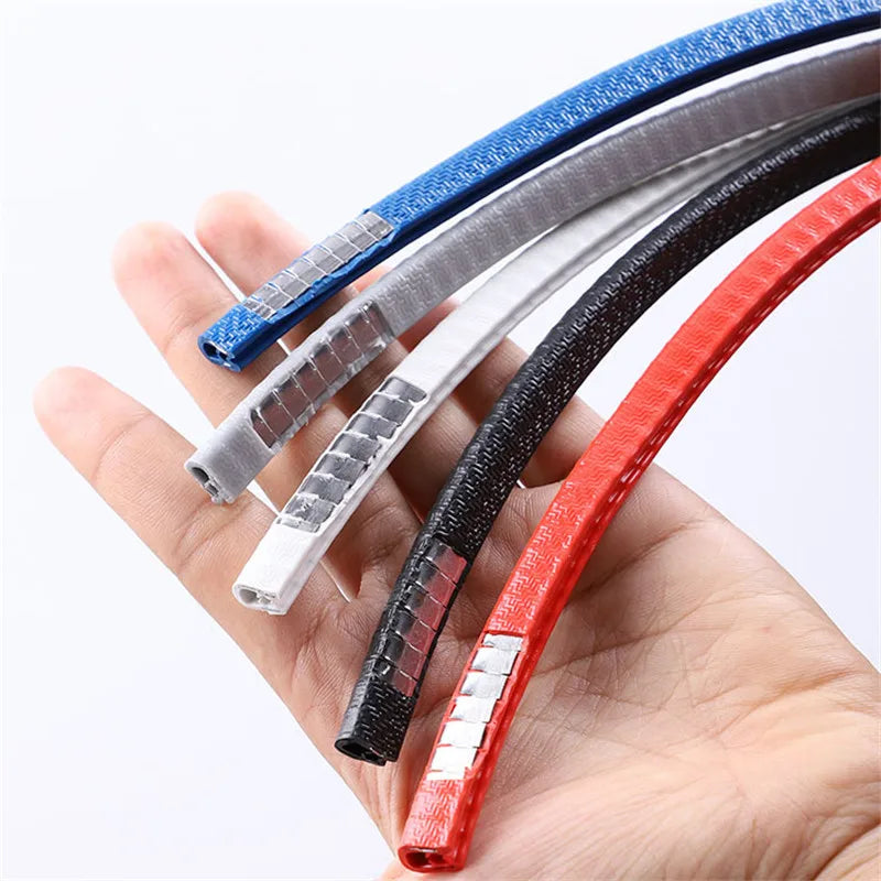 Four colorful ribbons held in a hand against a white background