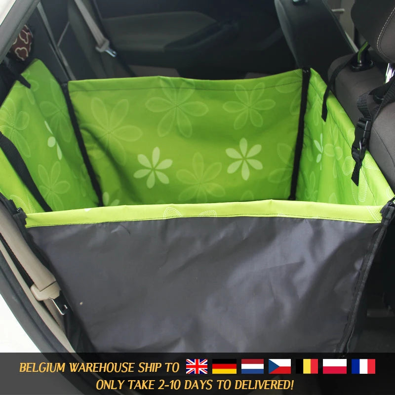 Green pet seat cover with floral pattern in a car