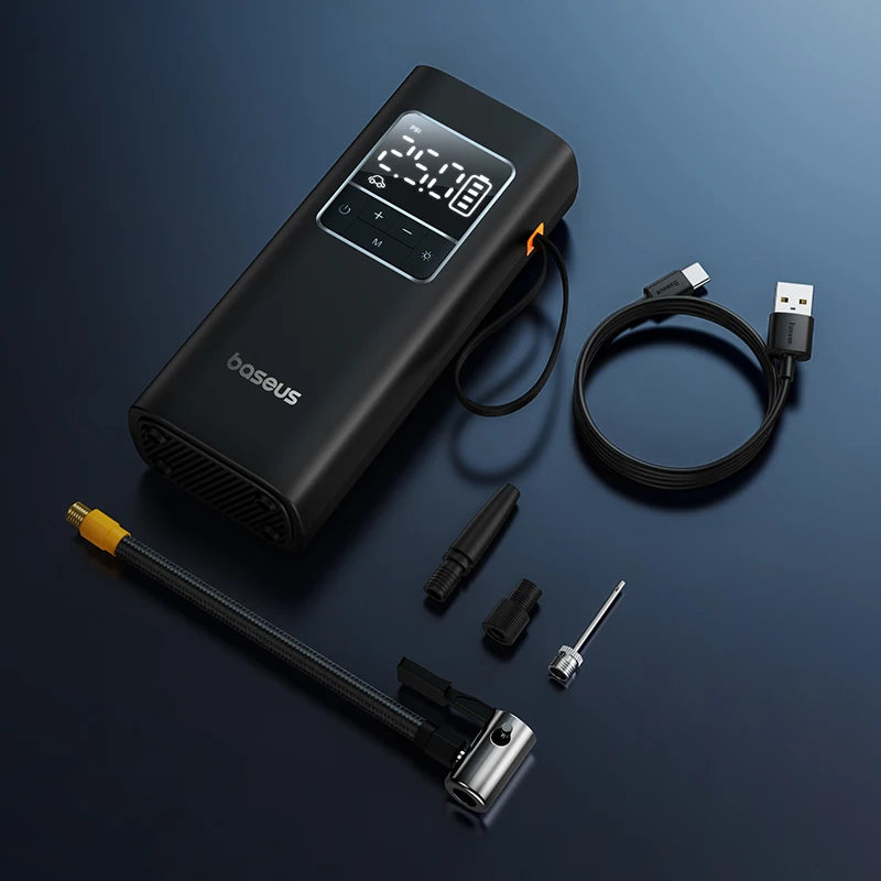 Black air compressor with digital display and accessories on a dark blue background