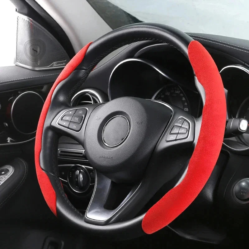 Steering wheel with red cover inside a car
