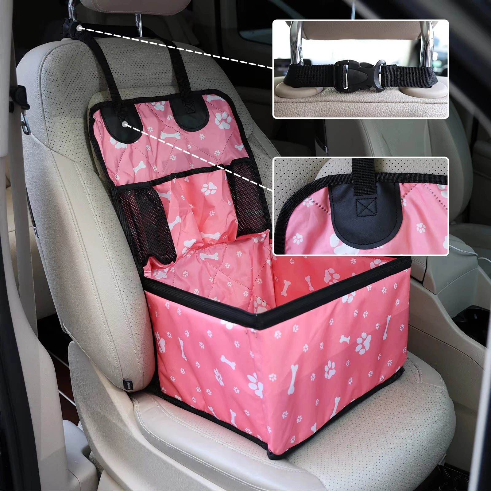 Pink pet car seat cover with paw prints on a car seat, showing details of straps and design.
