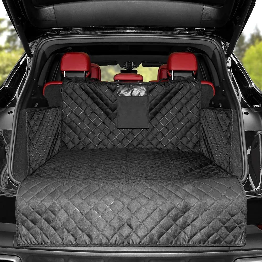 Black quilted car mat in a car's open trunk with red interior seats.