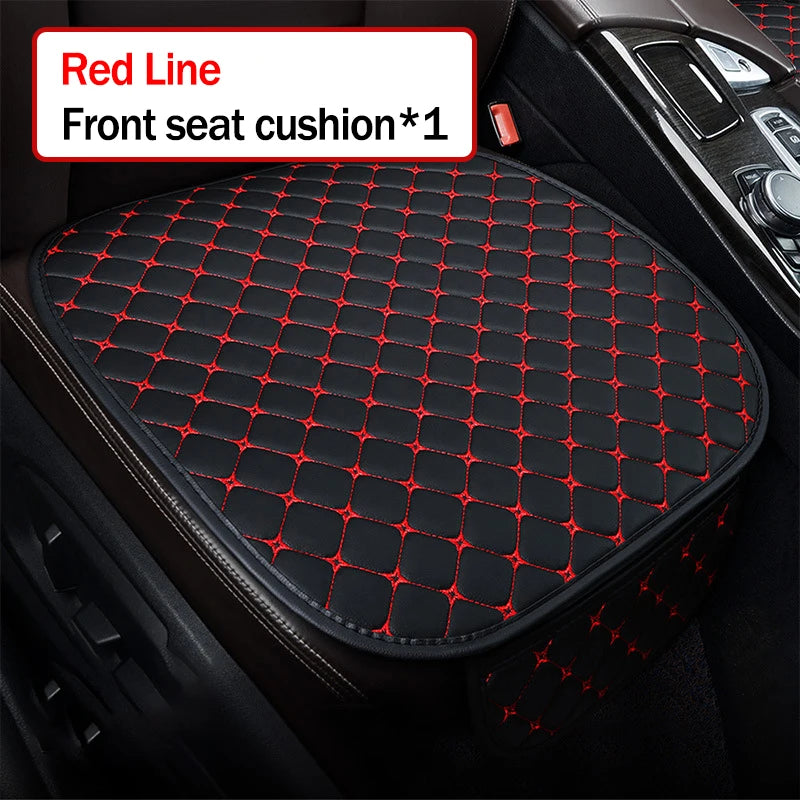 Car seat cushion with red stitching on a black car interior background