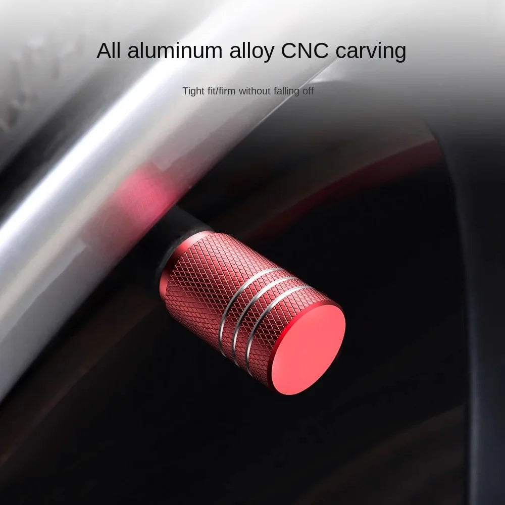 Red metal valve cap on a car tire with text about CNC carving and fitment.