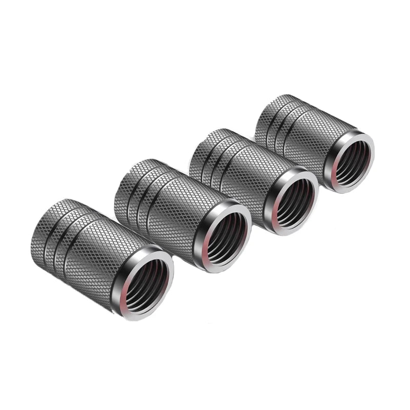 Five metallic cylindrical objects with textured surfaces on a white background