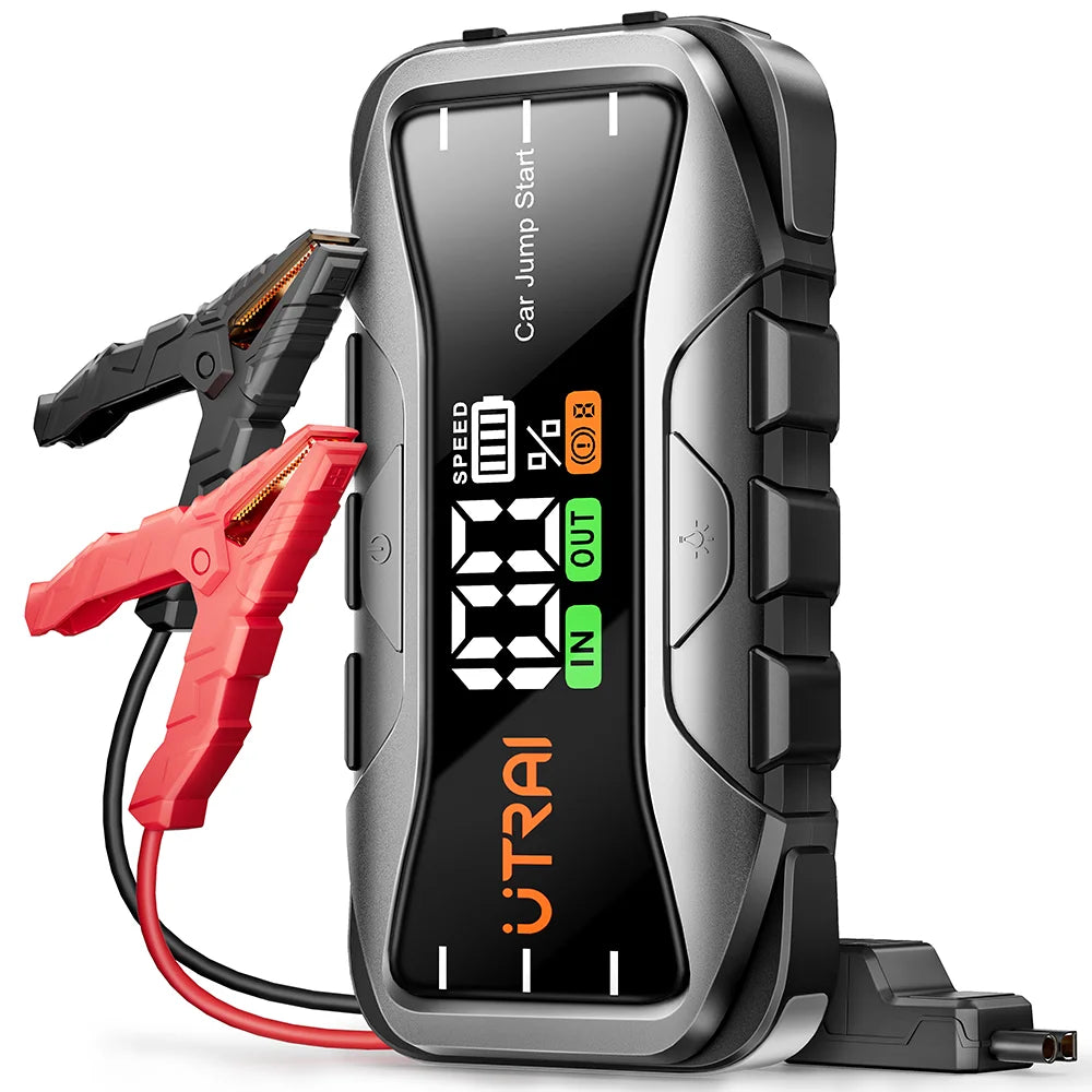 Car jump starter with digital display and red clamps on a white background