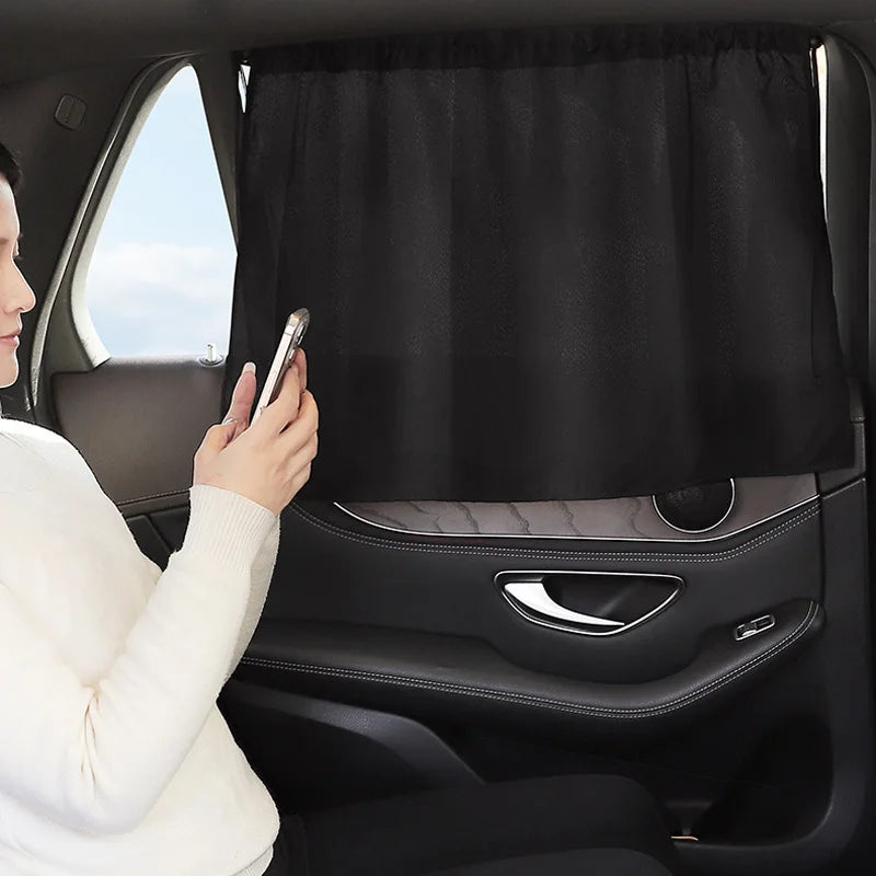 Person using a smartphone with a car seat cover in the background