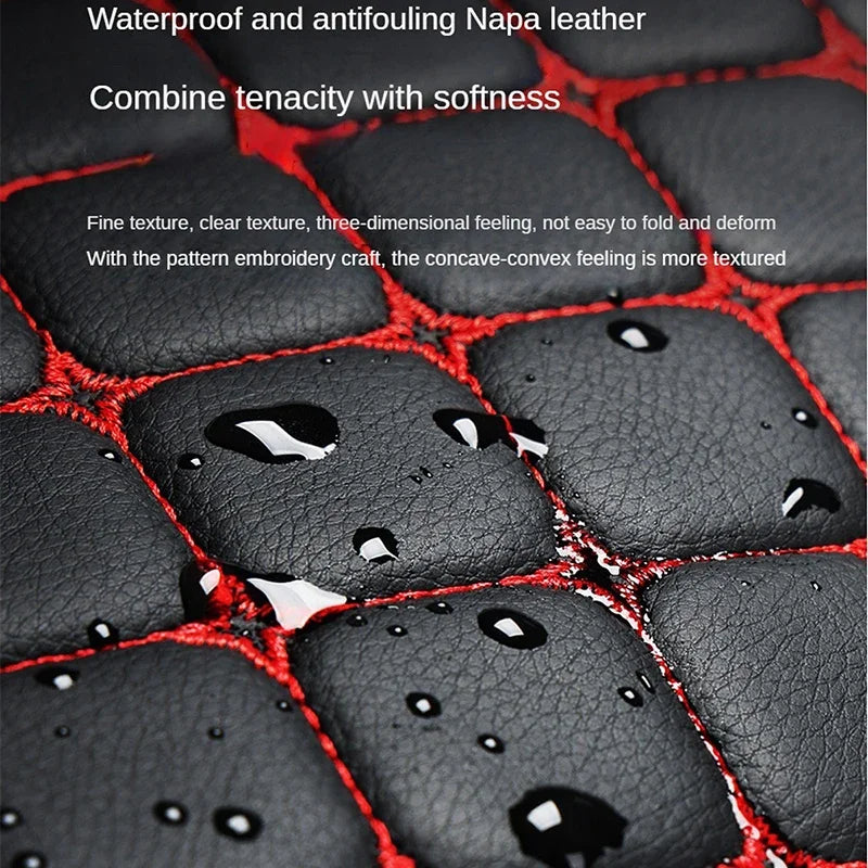 Close-up of black leather with red stitching, highlighting texture and craftsmanship.